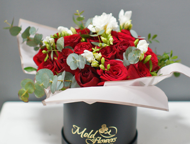 Box with red roses and freesias photo